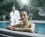 Woman enjoying the Naturhotel outdoor pool 